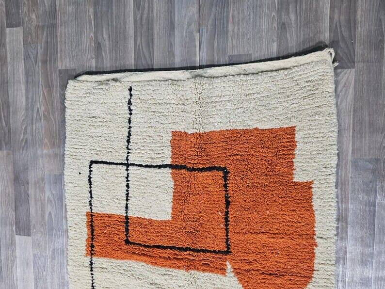 Traditional handmade wool Berber rug with colourful patterns.