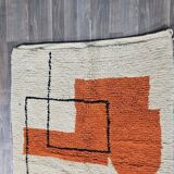 Traditional handmade wool Berber rug with colourful patterns.
