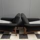 set of two black and white arm chairs 1960s