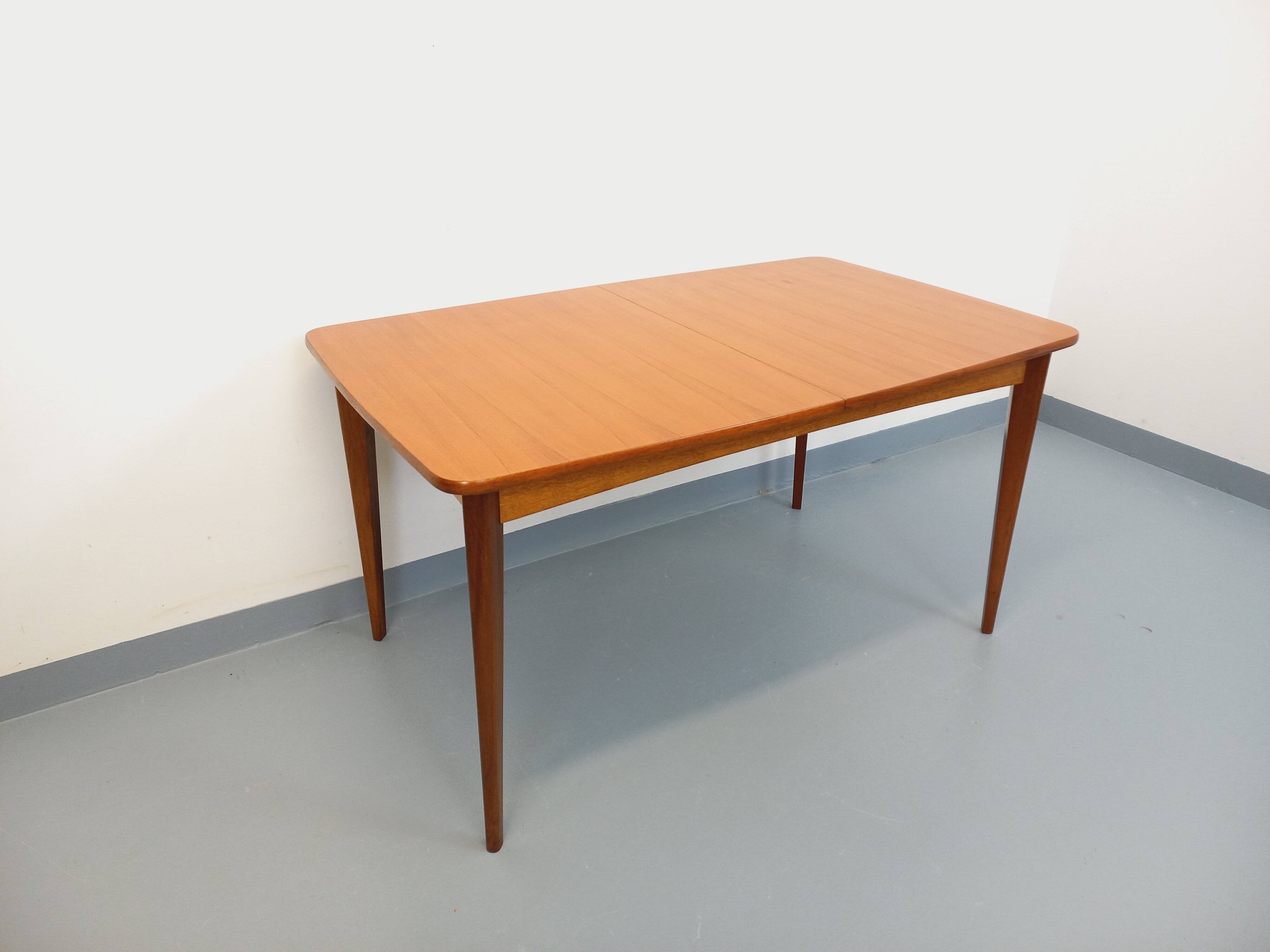 Rectangular dining table in vintage Scandinavian style from the 50s and 60s, made of teak.