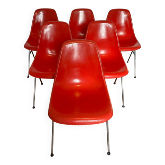 7 red fiberglass Stella chairs