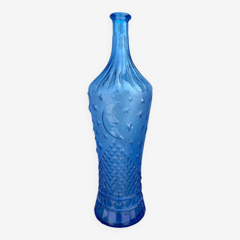 Blue glass decanter with a moon star motif