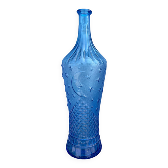 Blue glass decanter with a moon star motif