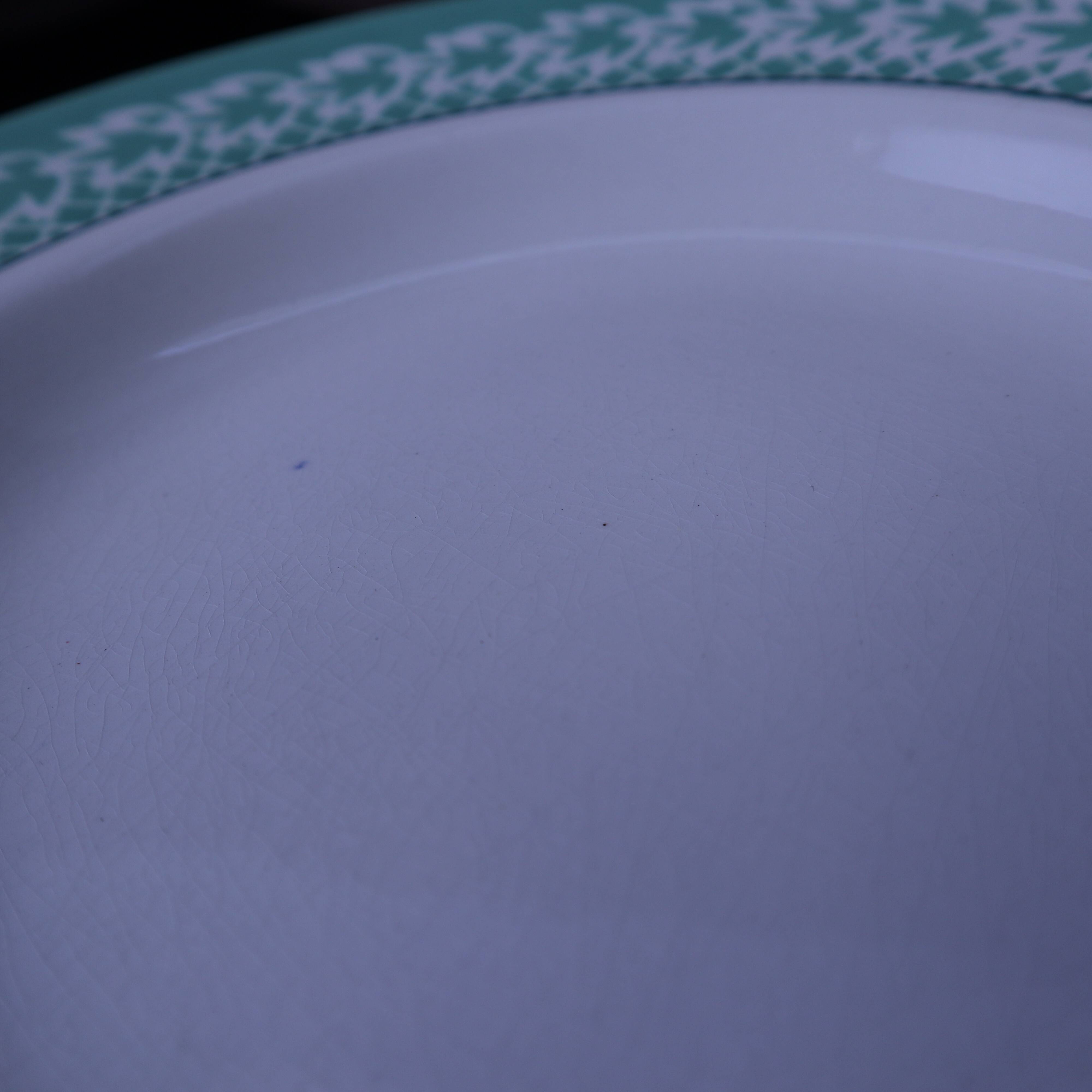 Set of 6 KIFO L'Amandinoise deep plates with green leaf design.