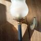 Frosted glass globe wall light with patinated gold metal base dp 1123204