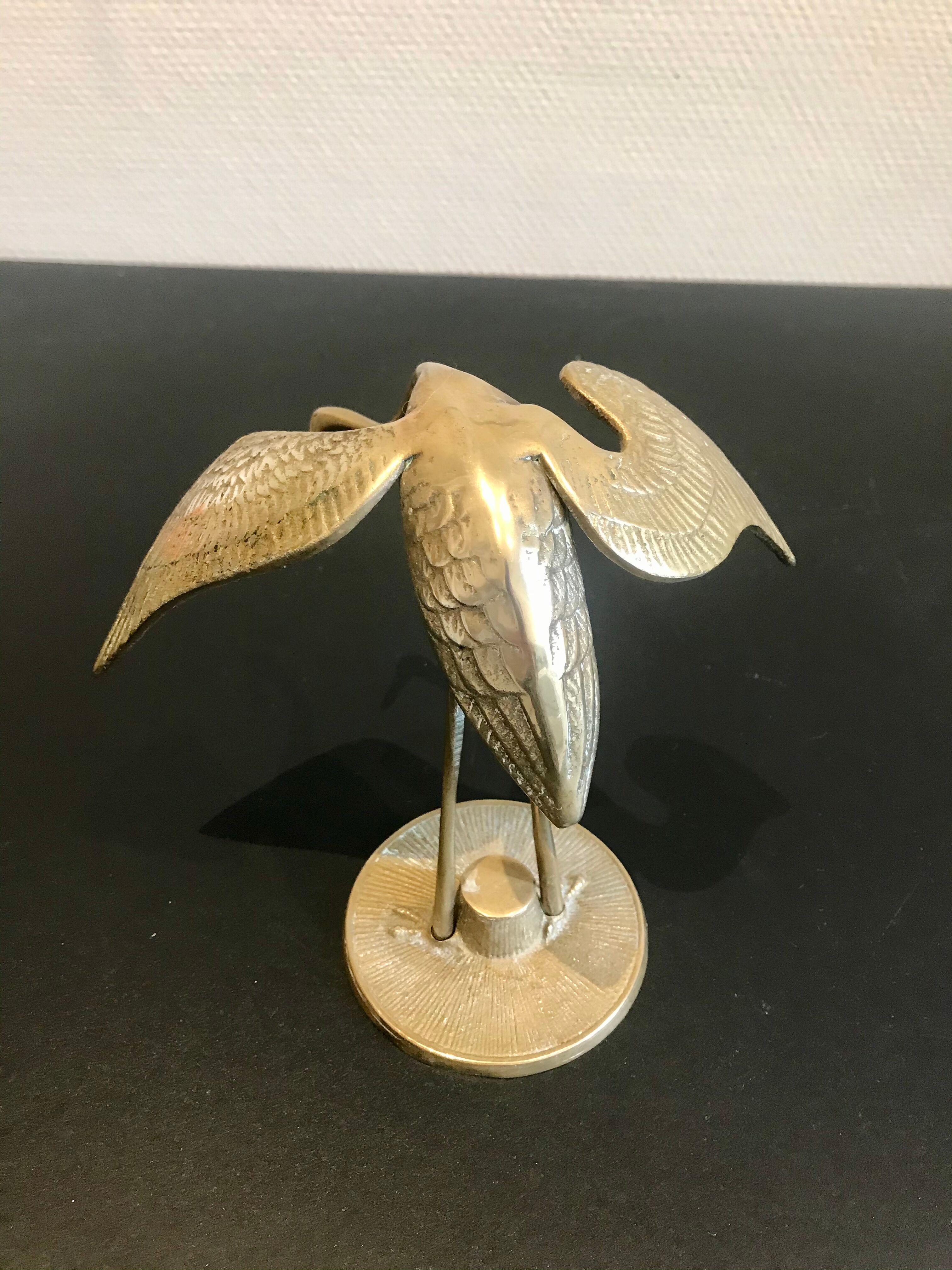 Couple of brass birds
