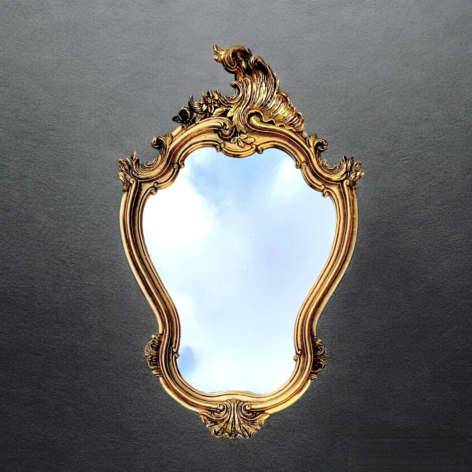 Old wall mirror in golden resin rococo style - made in france