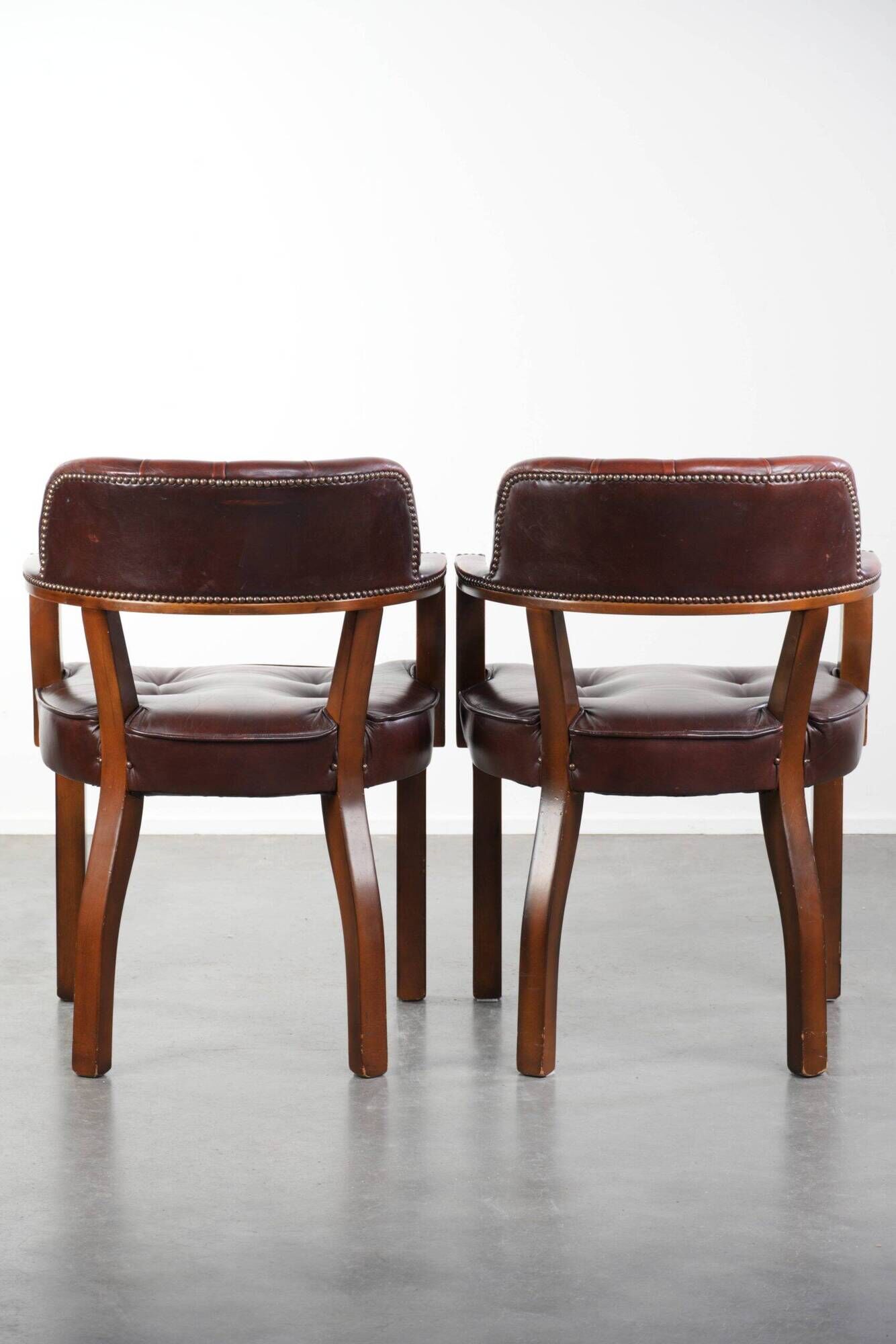 Set of two dark brown cowhide leather Chesterfield dining/side chairs