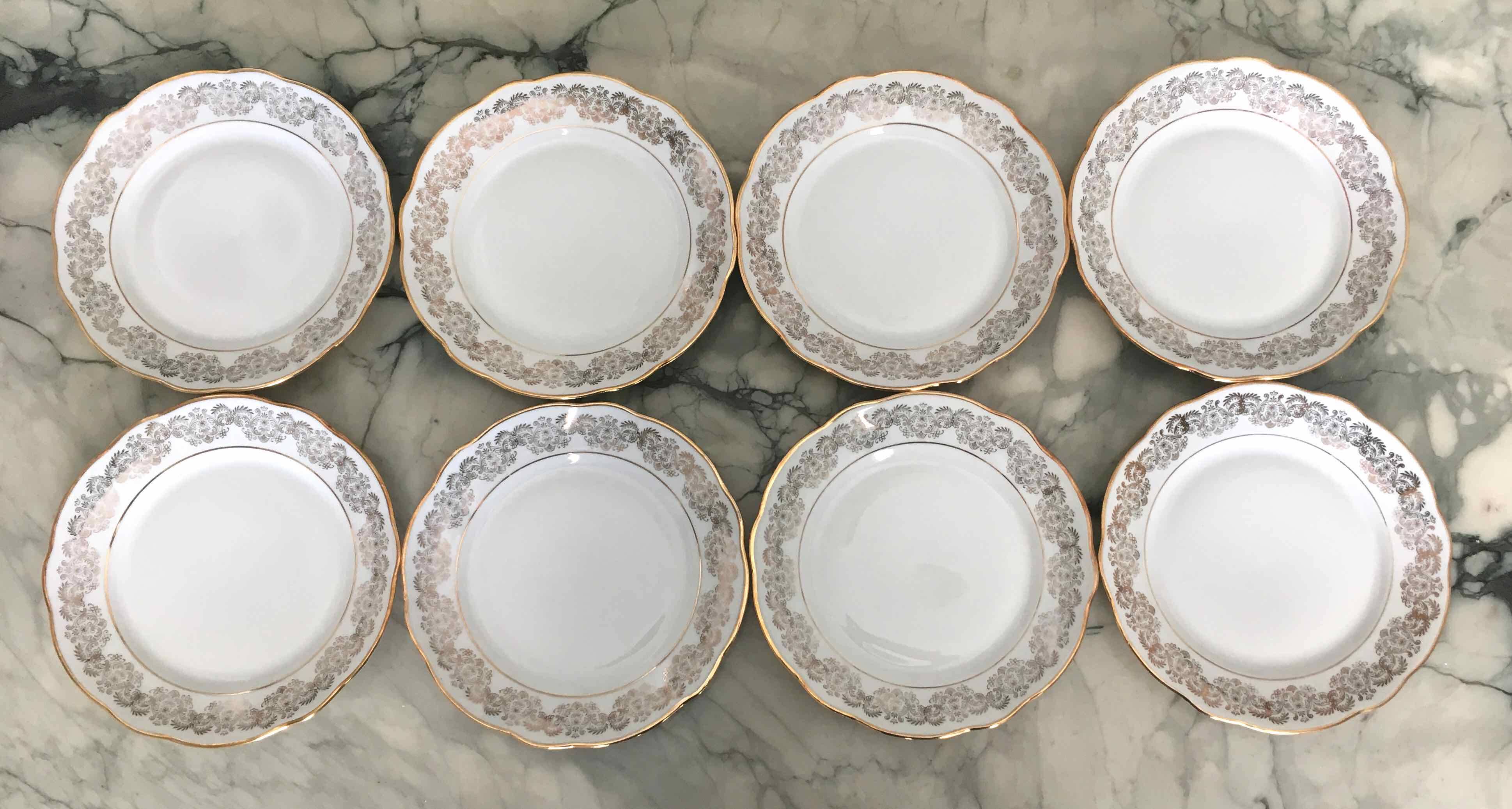 8 white and gold porcelain dessert plates