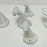 Five art deco white porcelain hooks
