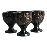 3 black ceramic egg cups, floral patterns