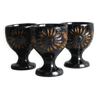 3 black ceramic egg cups, floral patterns