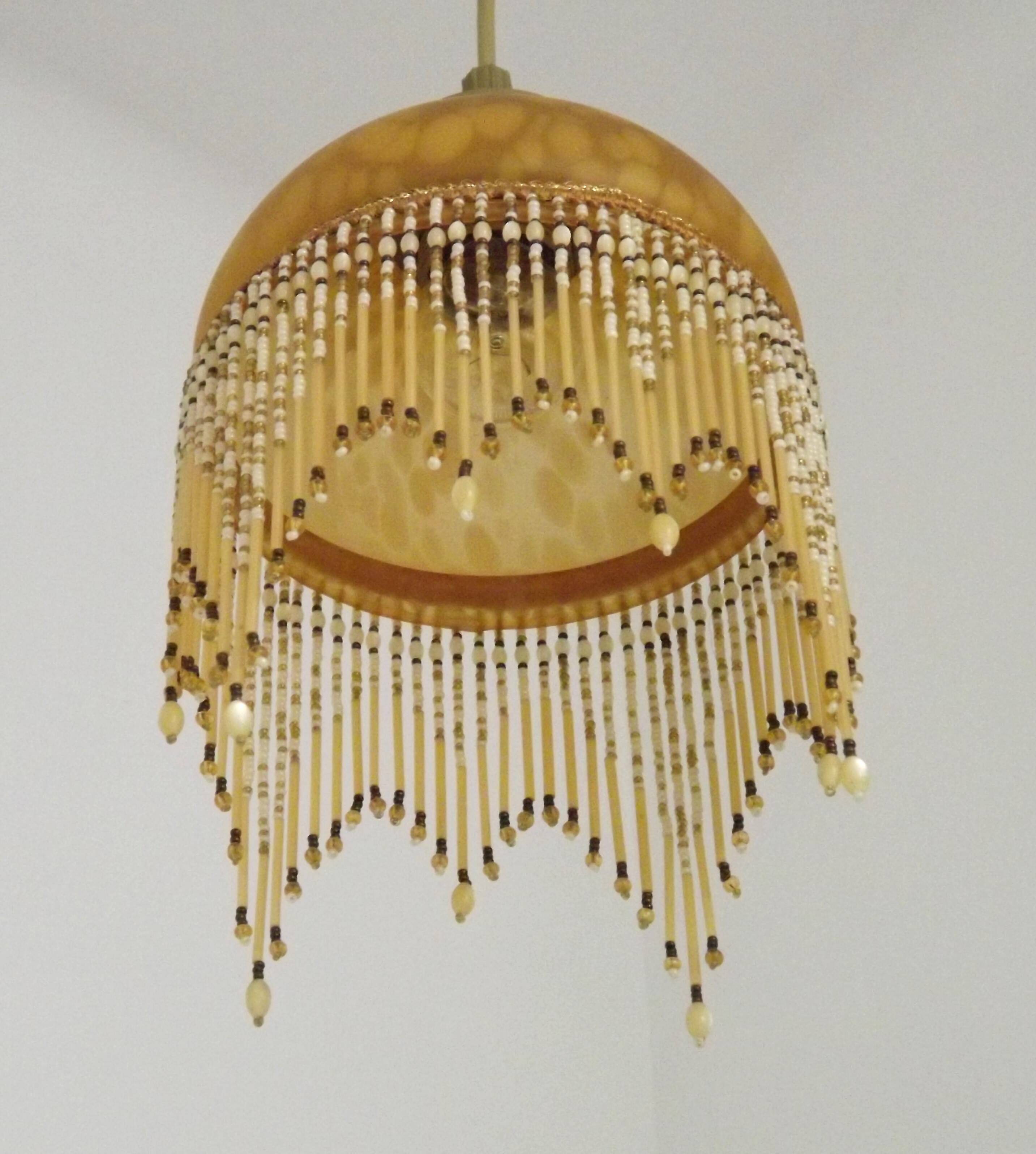 Vintage French amber mottled glass hanging ceiling light with beaded fringe.