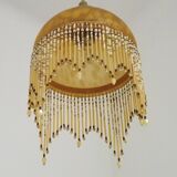 Vintage French amber mottled glass hanging ceiling light with beaded fringe.