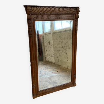 Miroir ancien de cheminée en bois sculpté et miroir biseauté
