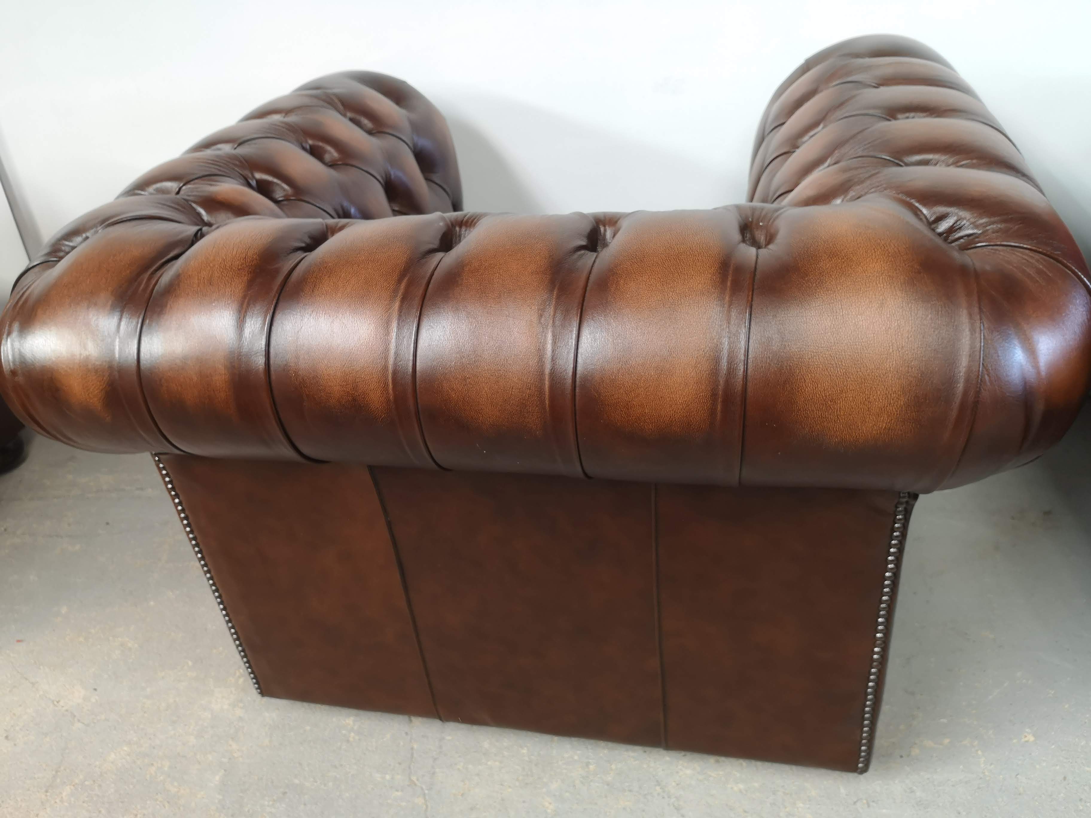 Brown leather chesterfield armchair