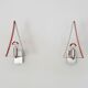 Pair of triangular wall sconces in chrome metal and orange. 1970s.