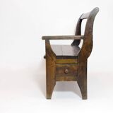 Handcrafted wooden bench with armrest and left drawer.