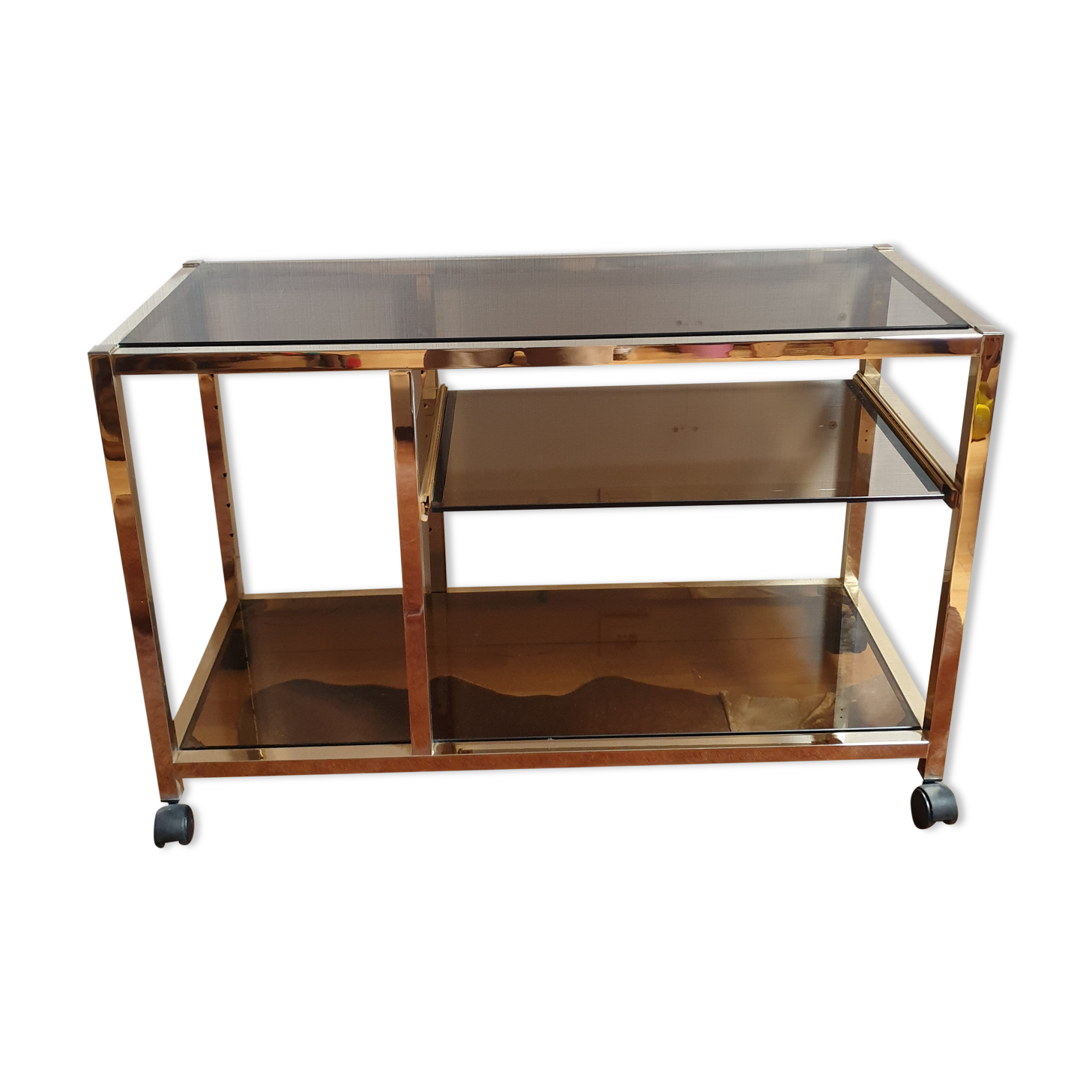 Service table with vintage brass wheels / smoked glass