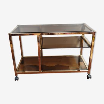 Service table with vintage brass wheels / smoked glass