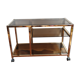 Service table with vintage brass wheels / smoked glass