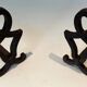 Pair of Modernist Andirons in Cast Iron with Stylised Figure Supports, by Ray