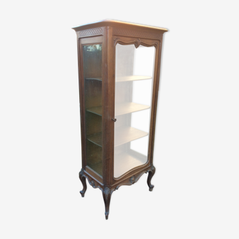 Louis XV Rocaille style showcase in solid walnut, beveled door glass.