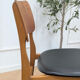 Set of 4 Danish chairs in teak and black faux leather, 1960s.