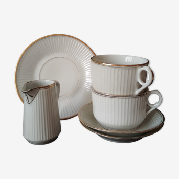 White porcelain breakfast set and golden ledé