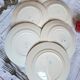 Old mismatched flat plates in earthenware
