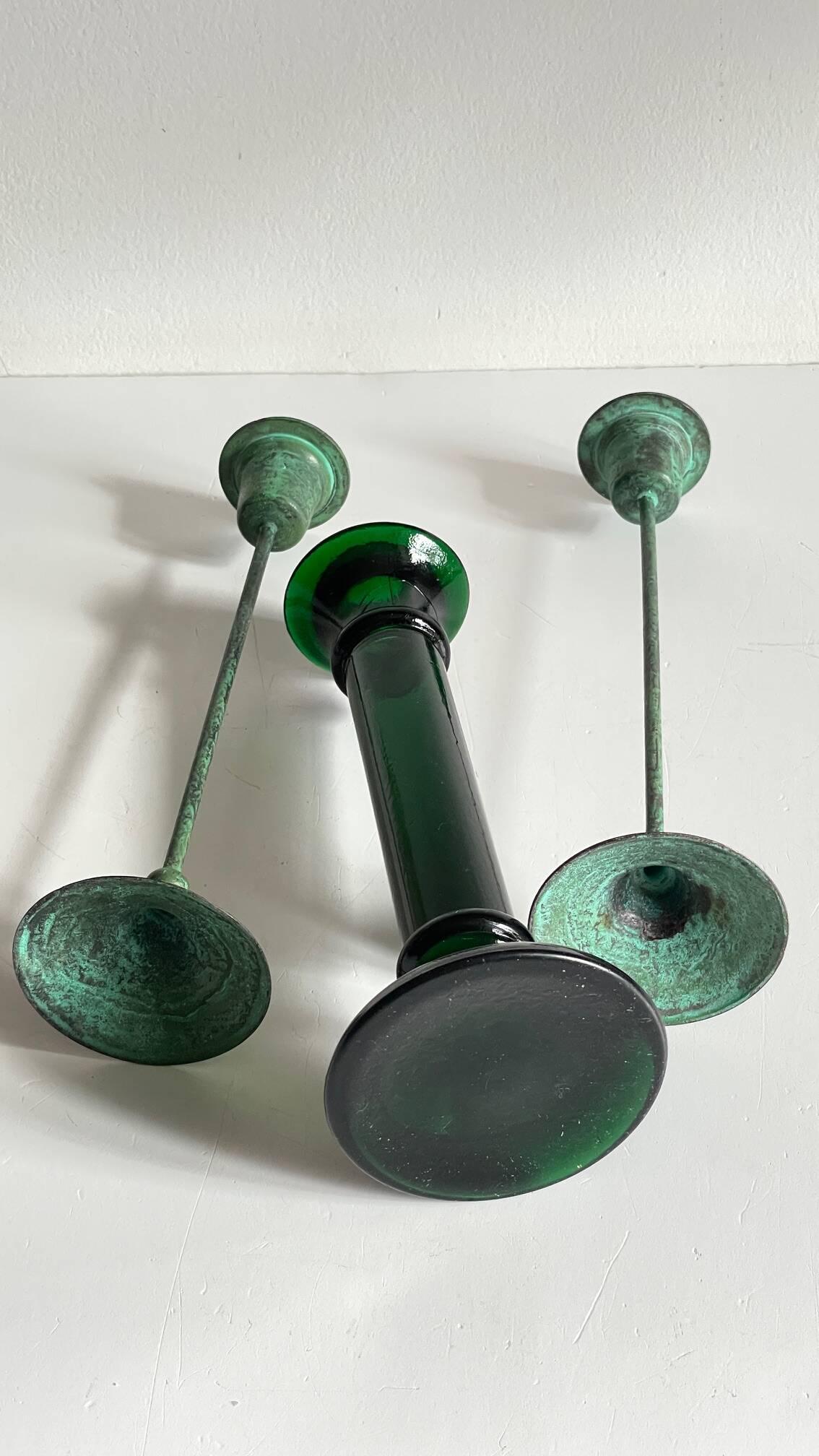 Green glass and metal candle holders