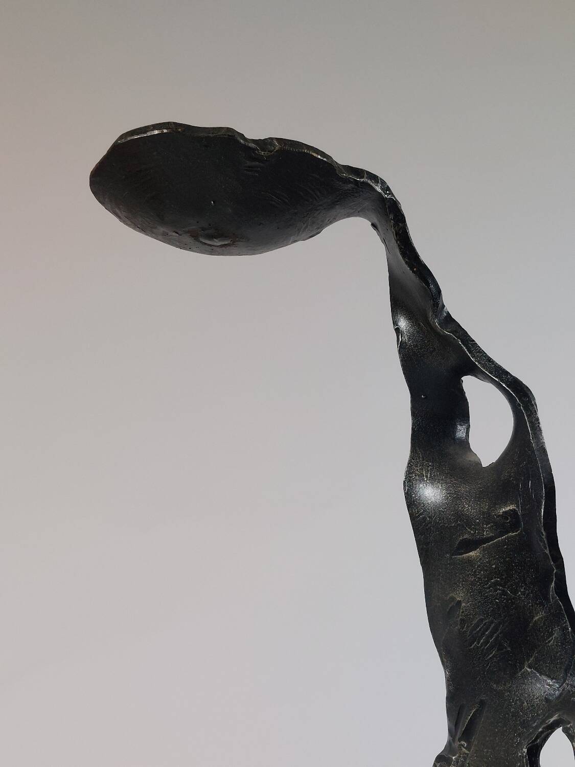 Sculptural brutalist floor candle holder made of hand-forged iron from the 1950s.