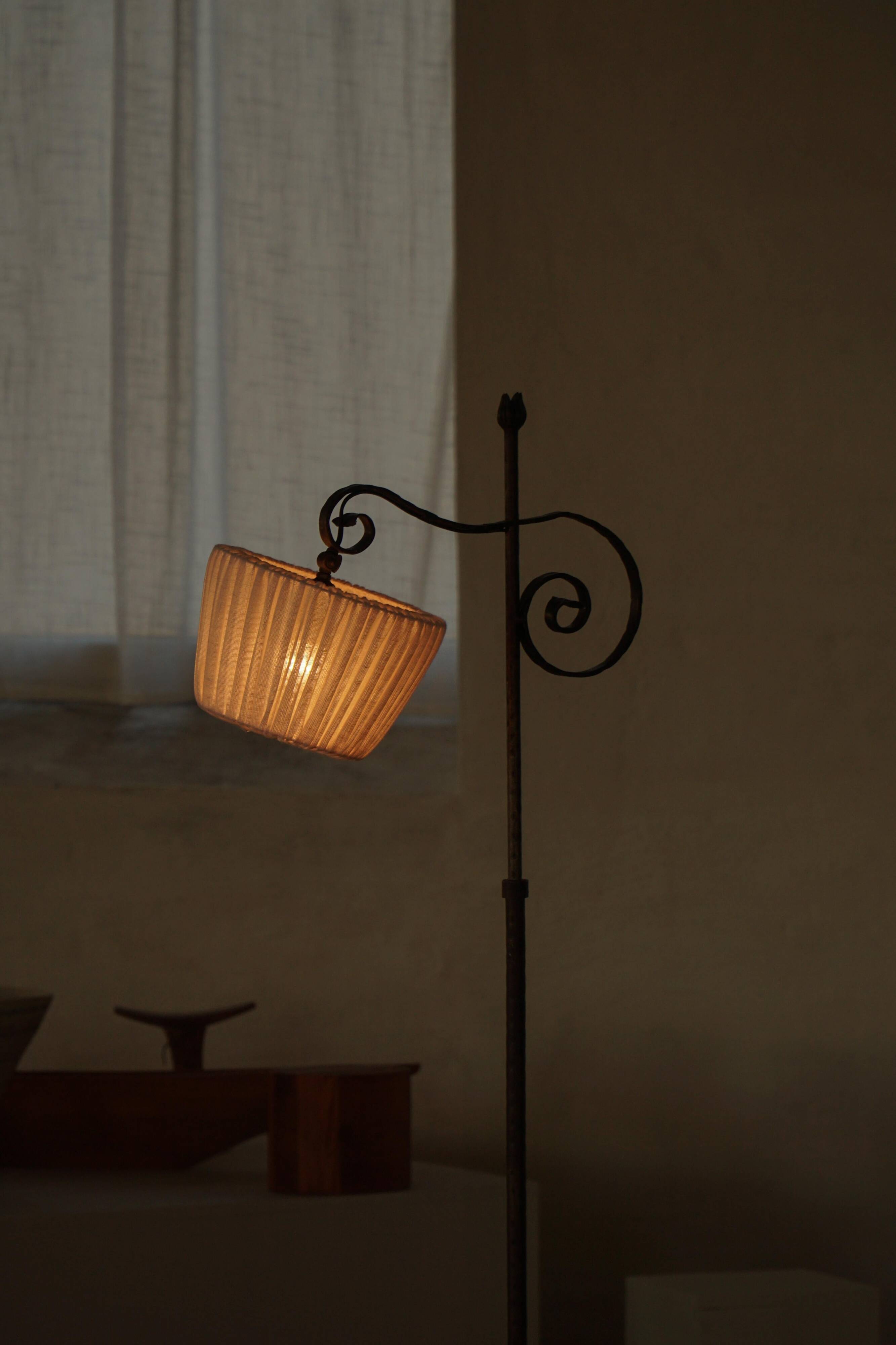 20th-century wrought iron floor lamp with swirling detail, Danish Art Deco.