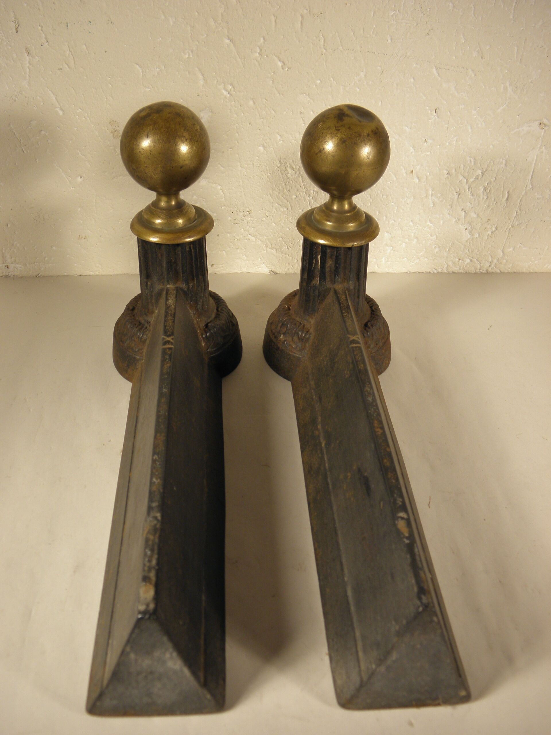 Pair of cast iron and brass chenets