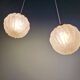 Pair of Art Deco pendant lights in pressed molded satin glass, 1920-30