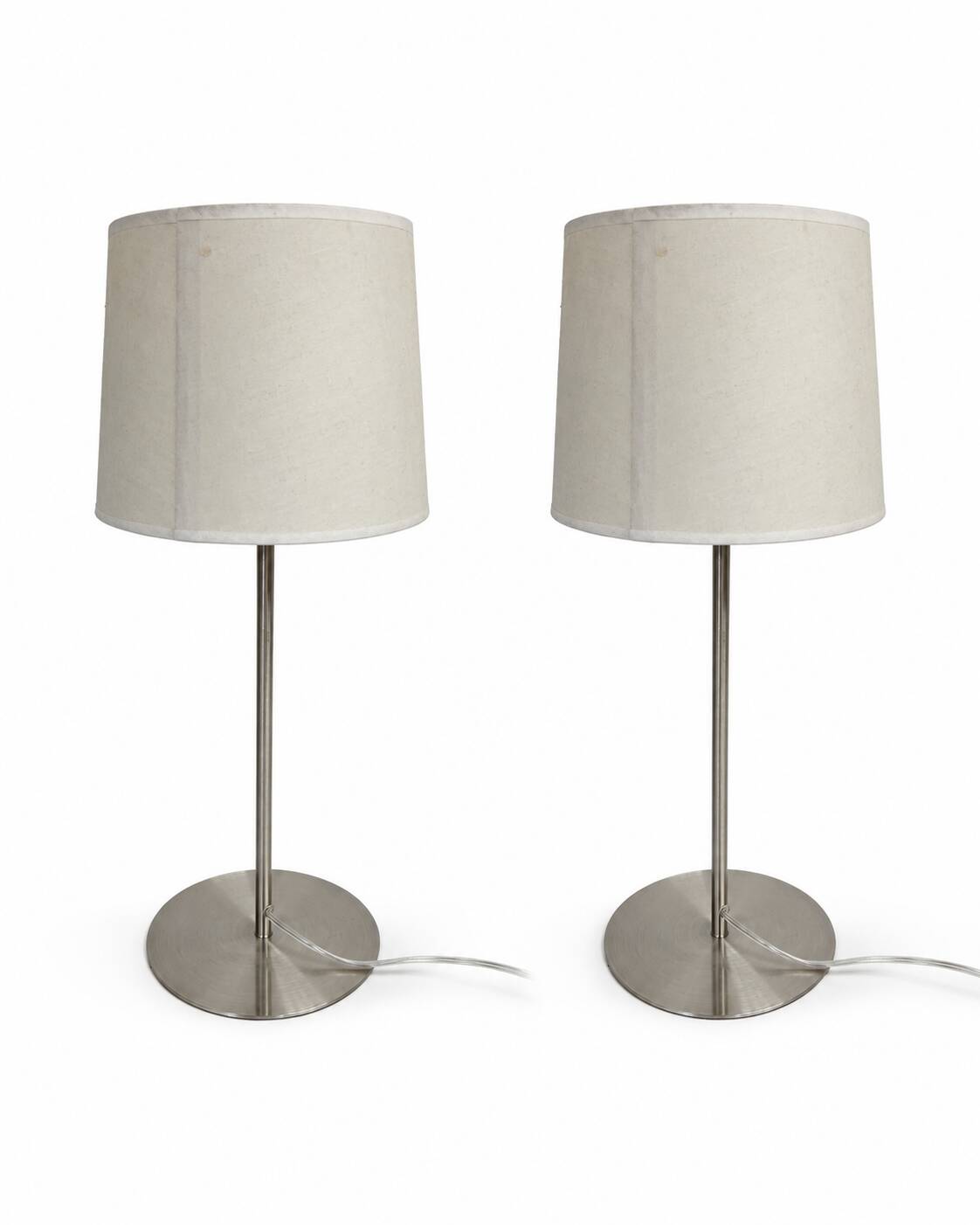 Pair of large brushed metal lamps with cream shades.