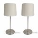 Pair of large brushed metal lamps with cream shades.