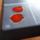 Small 1960s enamelled table, spindle legs, signed jd.