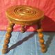 Wooden milking stool with twisted legs
