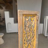 Rectangular Indonesian construction element with blue and yellow plant in carved wood