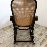 Rocking chair en bois et cannage vintage