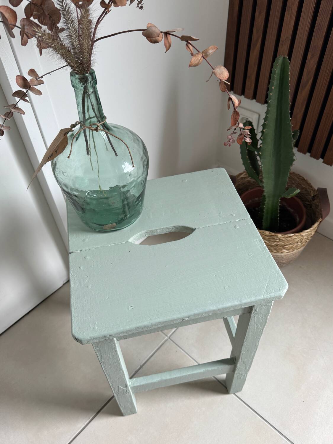 Antique almond green wooden stool
