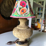 Sandstone foot accent lamp surmounted by a painted lampshade