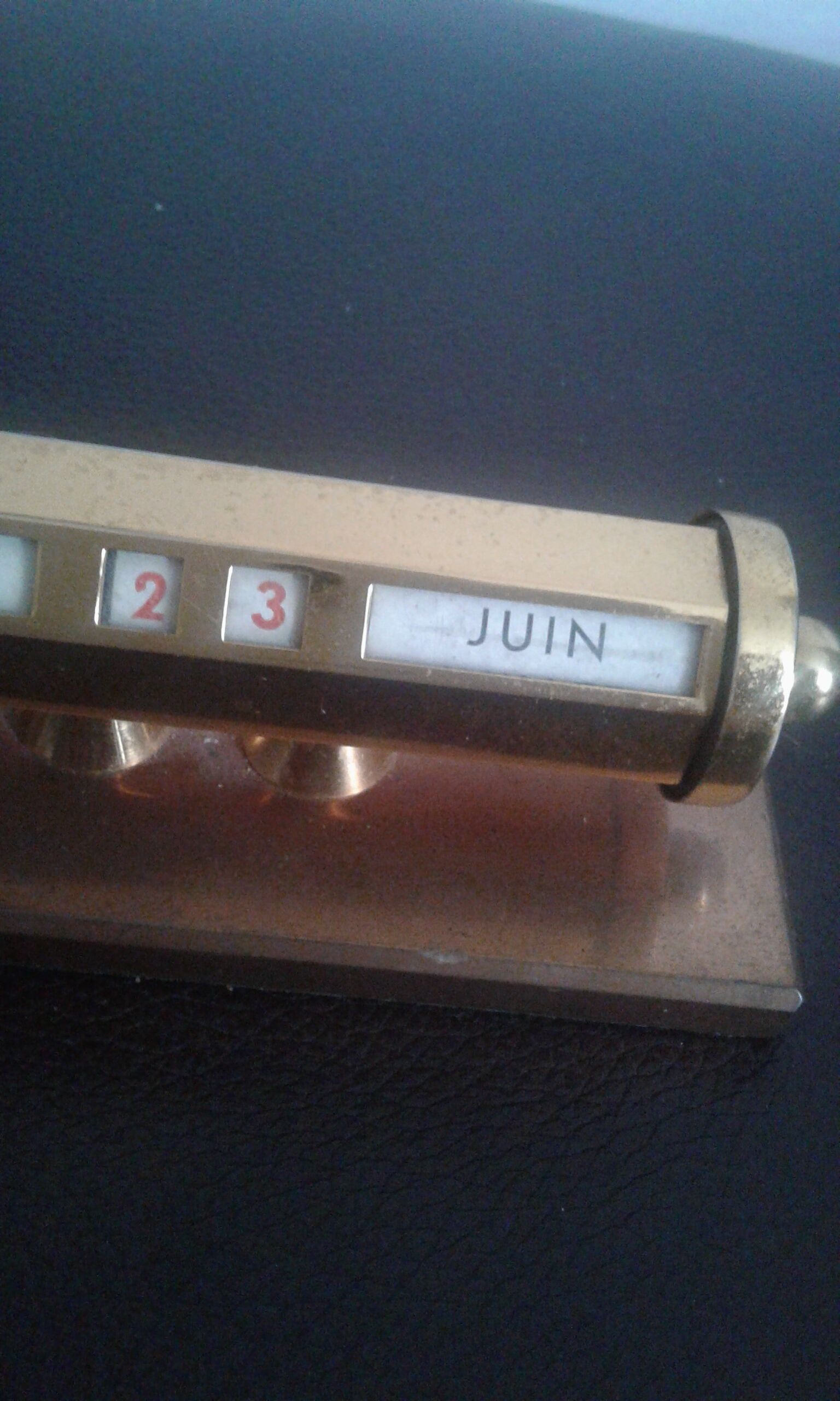 Ancient brass turnstile calendar