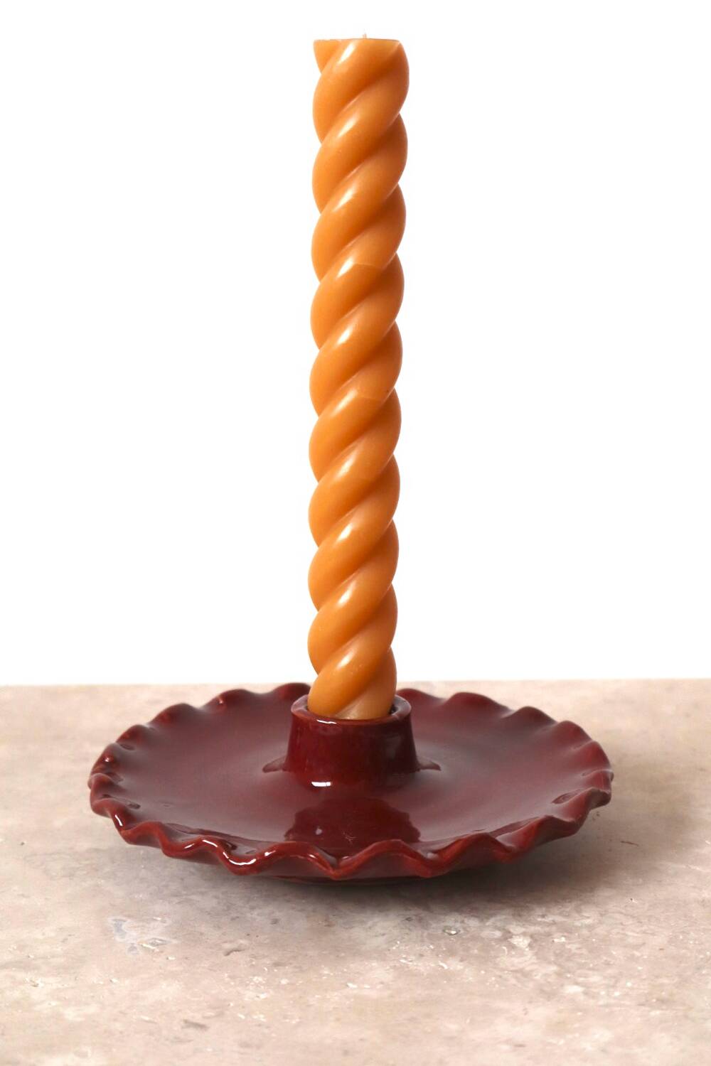 Burgundy ceramic candle holder with serrated plate