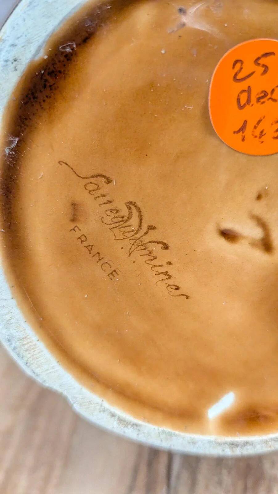 Vintage Sarreguemines pitcher with brown relief decoration.