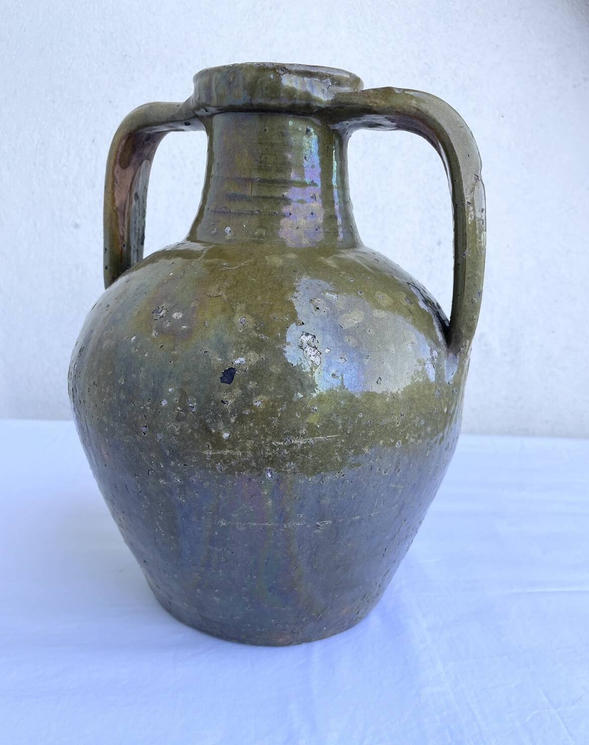 Ancient oil jar in glazed terracotta, khaki green — Auvergne, Lezou