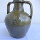 Ancient oil jar in glazed terracotta, khaki green — Auvergne, Lezou