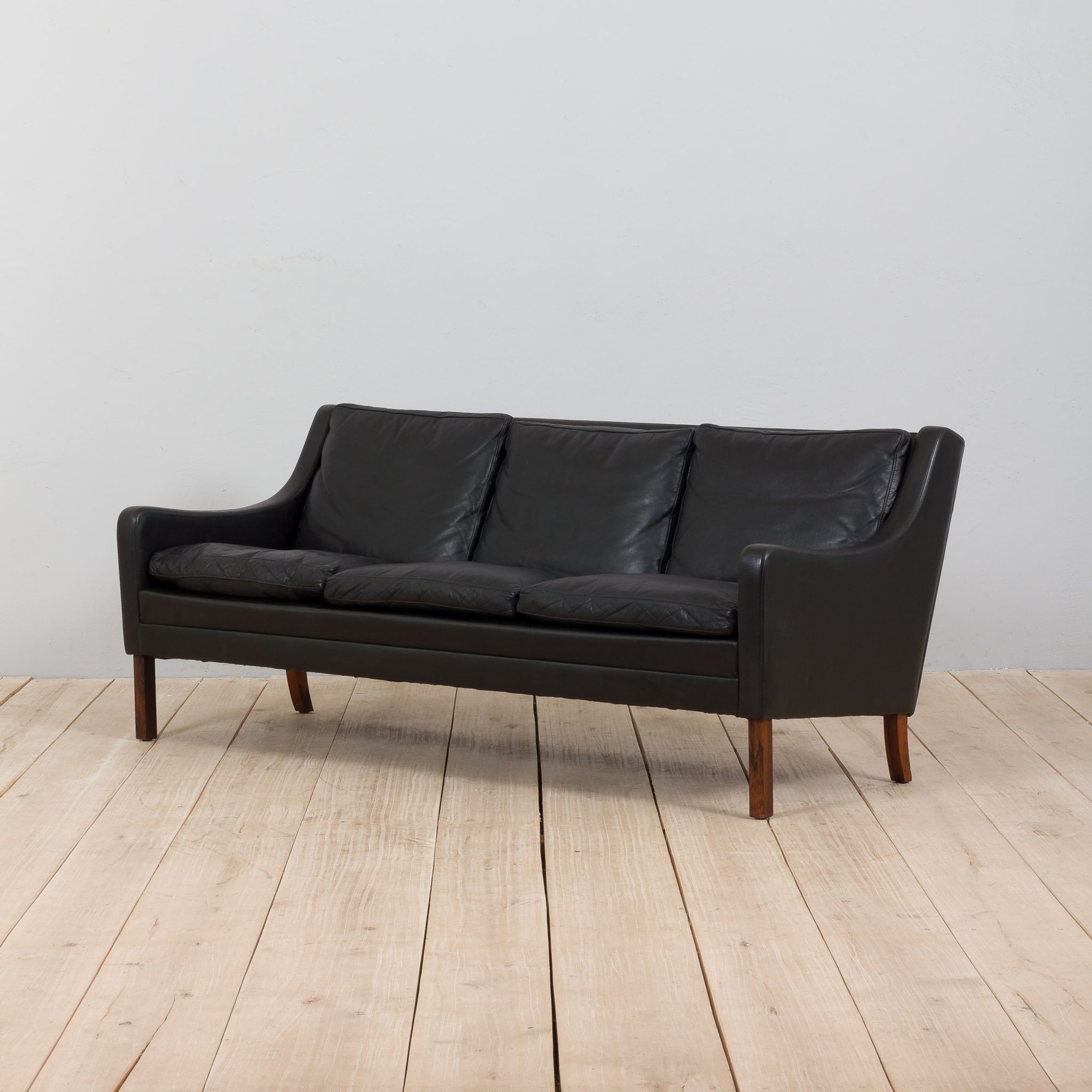 Danish black leather and rosewood sofa