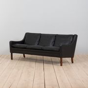 Danish black leather and rosewood sofa